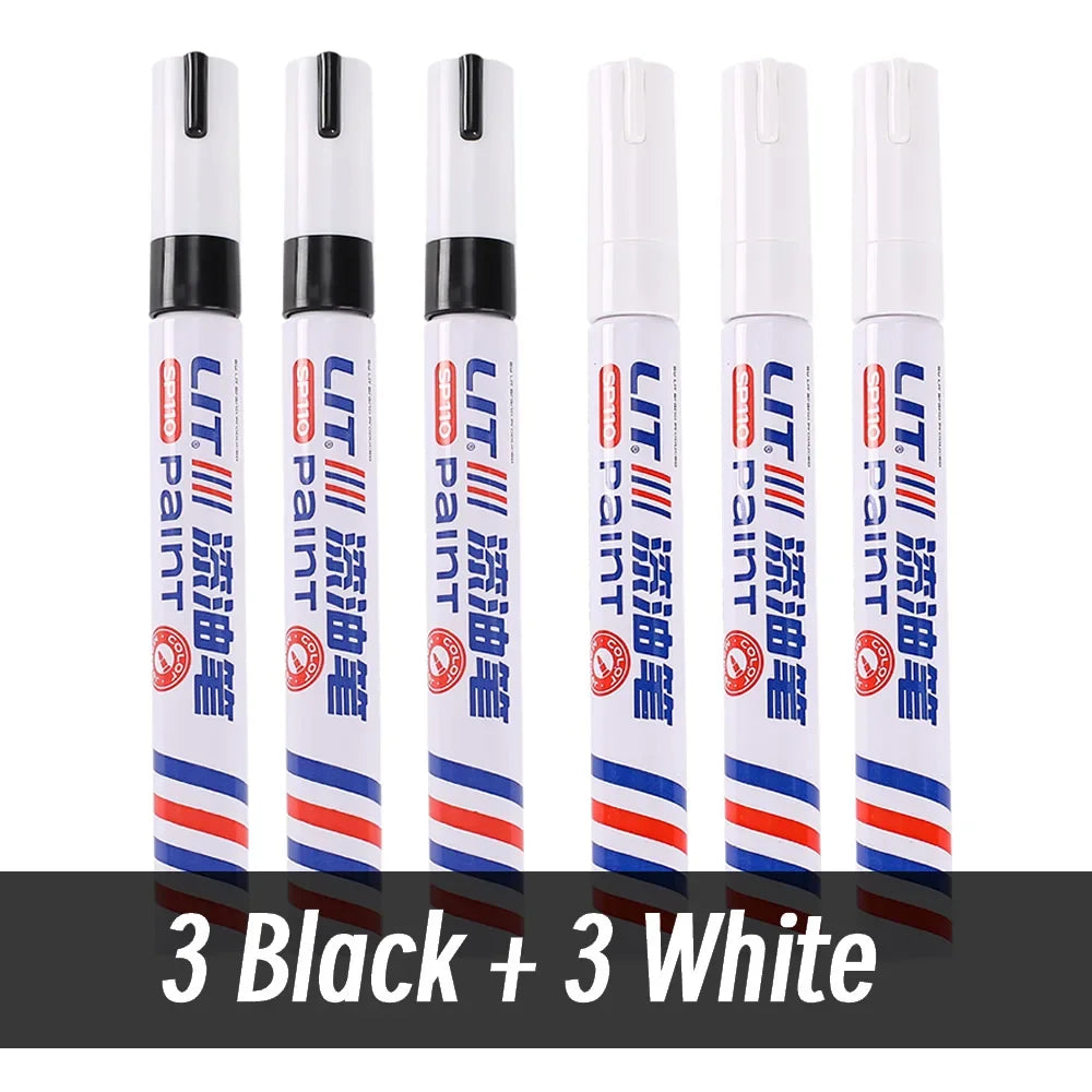 A set of nine permanent paint markers in black and white, arranged vertically.