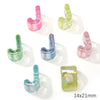 A collection of colorful acrylic alphabet beads in various shades of pink, green, and blue.