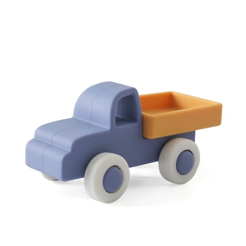 A blue wooden and silicone car teether toy with an orange tray and white wheels.