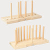 A wooden ribbon bow maker with multiple dowels for creating gift wrapping and holiday crafts.
