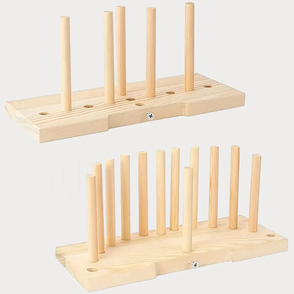 A wooden ribbon bow maker with multiple dowels for creating gift wrapping and holiday crafts.