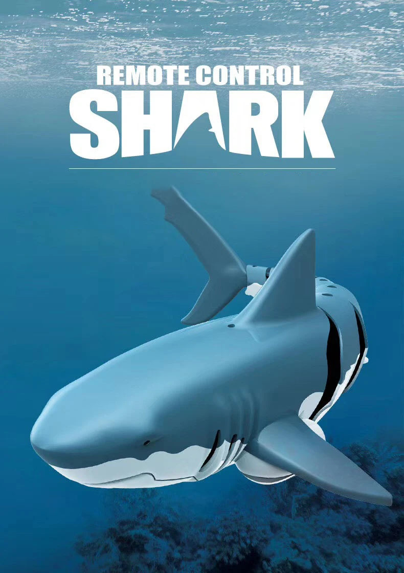 A white shark remote control toy is shown swimming underwater.