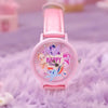 A pink My Little Pony Magic Sweetheart blind box watch with a pink strap resting on purple fuzzy fabric.