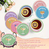 Eight coasters featuring wine glass designs in various colors and materials