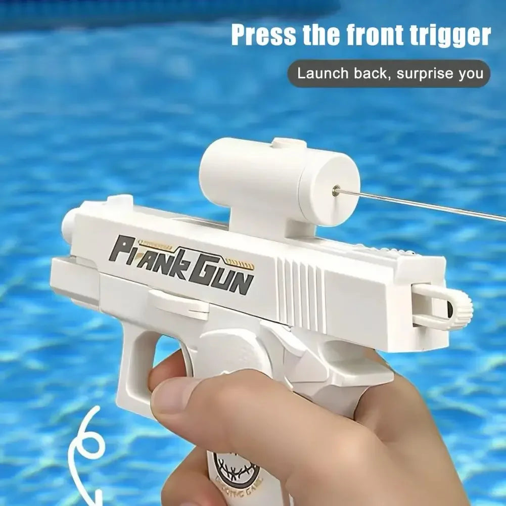A hand holds a white Pi-Ank gun water blaster, ready to launch water back.