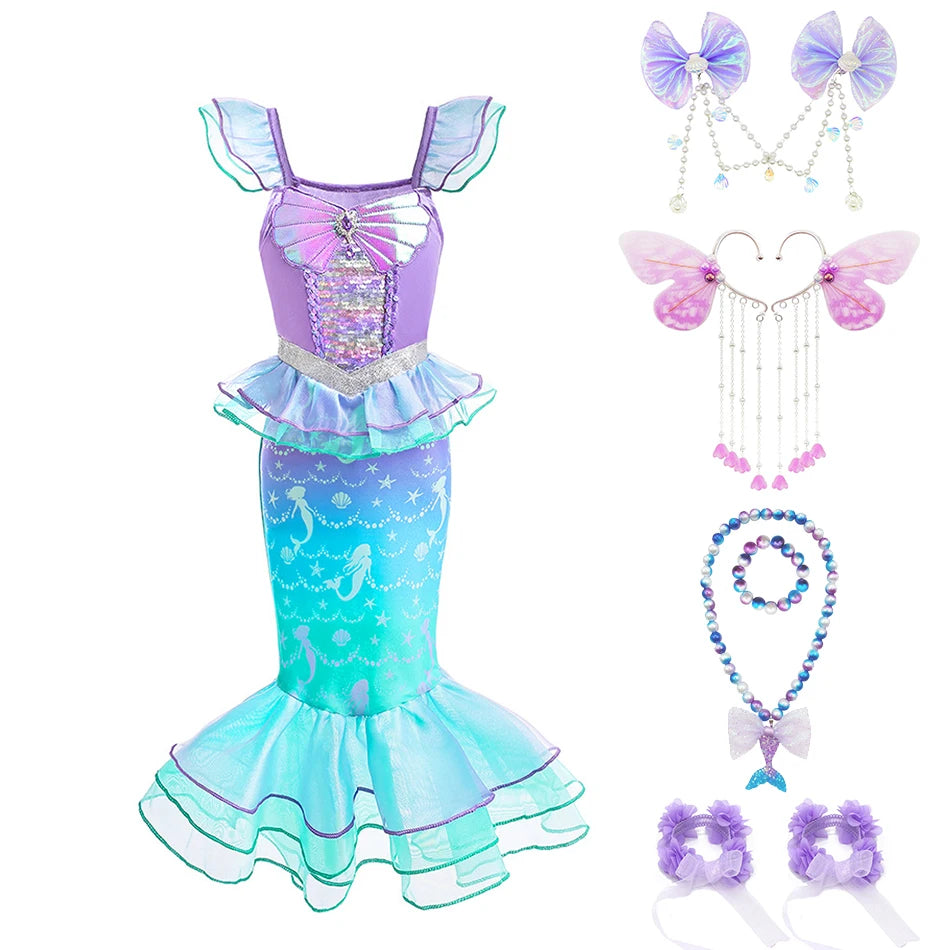 Girls mermaid fantasy dress featuring a purple bodice and iridescent teal ruffled fishtail skirt with matching accessories