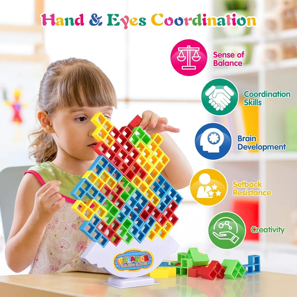 A young girl is building a colorful, multi-sized block structure for hand and eye coordination development.