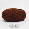 A ball of dark brown pre-dyed milk cotton yarn for knitting and crochet.