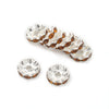 A row of 12mm crystal rhinestone spacer beads in an amber tone for jewelry making.