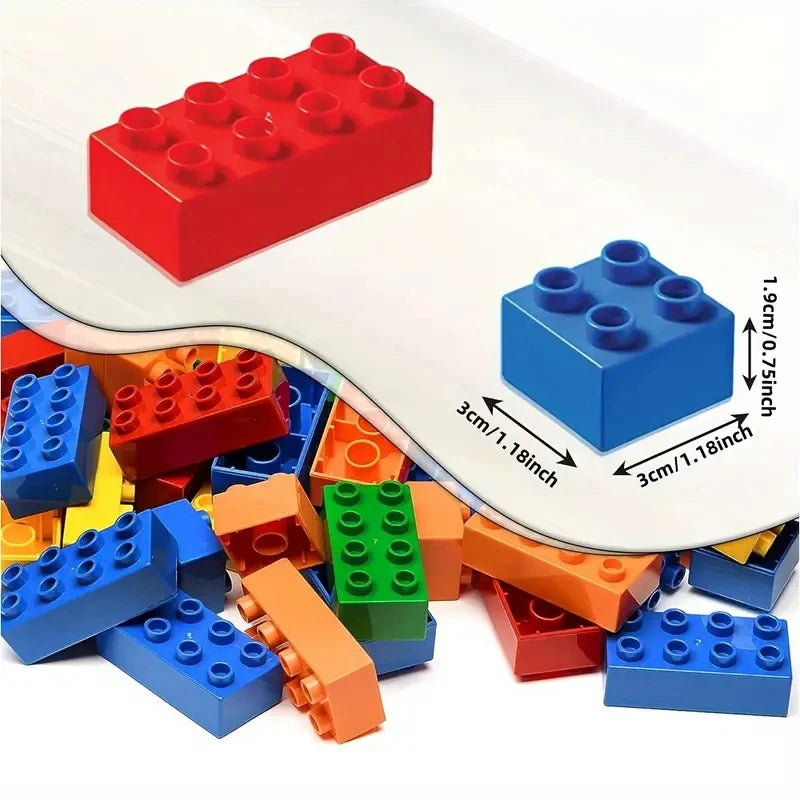 A collection of red and blue wooden building blocks scattered on a white surface.