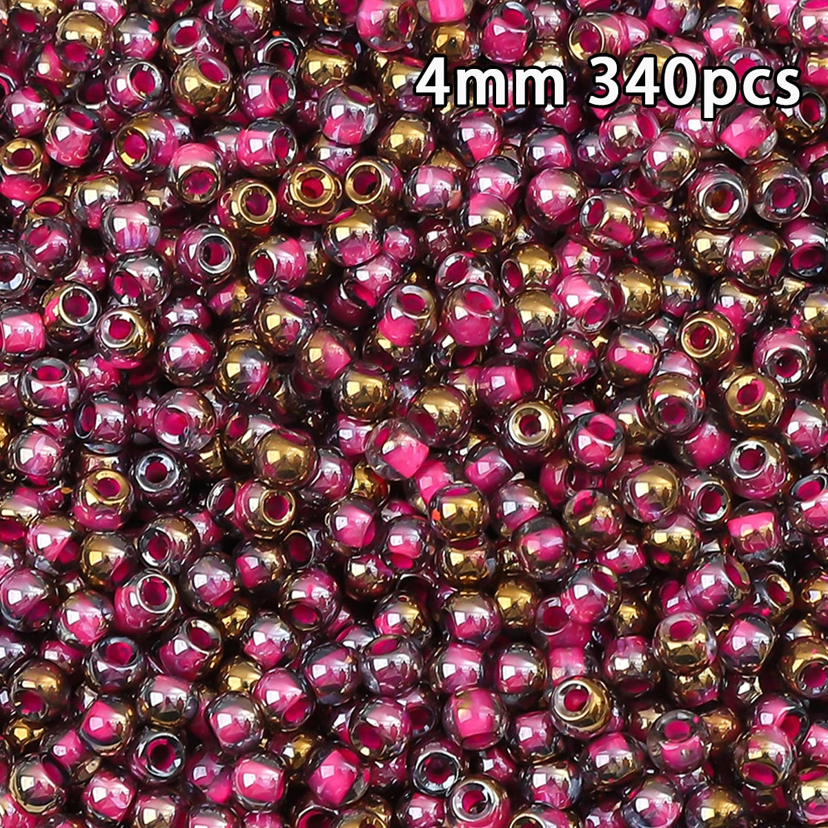 A close-up view of 340 golden gradient glass beads with pink accents.