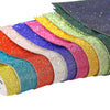 Colorful sparkling rhinestone adhesive tape rolls displayed in a rainbow gradient