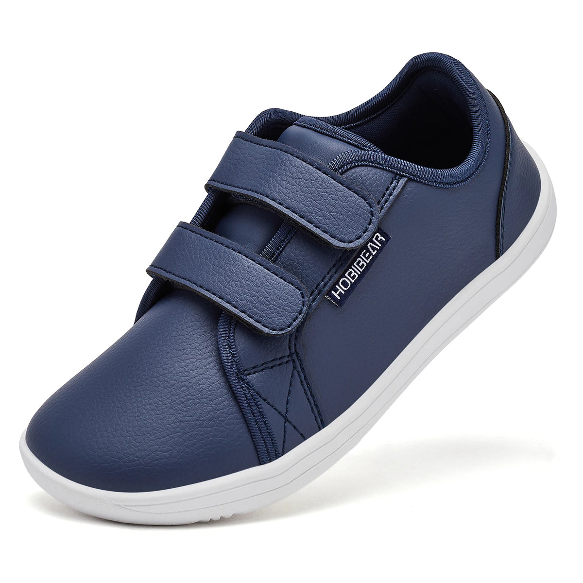 Navy blue kids barefoot sneakers with double hook-and-loop straps shown from the side.