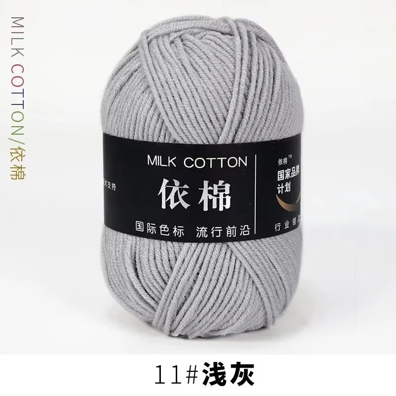 A ball of gray milk cotton yarn labeled with Chinese characters and a number 11