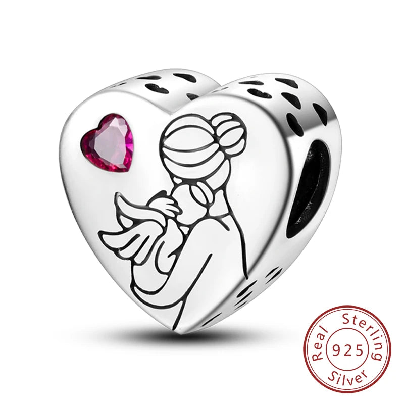 A sterling silver heart charm bead featuring a silhouette of a woman with flowing hair and a pink gemstone inset.