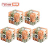 Five pieces of an orange and green 3D maze puzzle ball for a brain teaser challenge