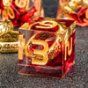 A red resin die with a golden elven number 39 and the text 'PEREGRINE' on its face.