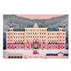 A jigsaw puzzle depicting the exterior of a large pink hotel building in a snowy, mountainous landscape.