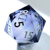 A handmade resin D20 die with a large blue and purple liquid swirl, viewed at an angle.