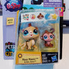 A plastic package containing three small animal figures, including a lion cub and an elephant, for sale in a PetShop box.