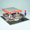 A 1:64 scale LED miniature car garage diorama featuring a storefront and parking lot.