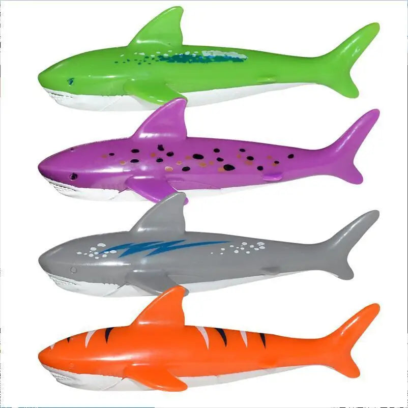 A set of four brightly colored shark-shaped pool diving toys for kids in green, purple, gray, and orange.