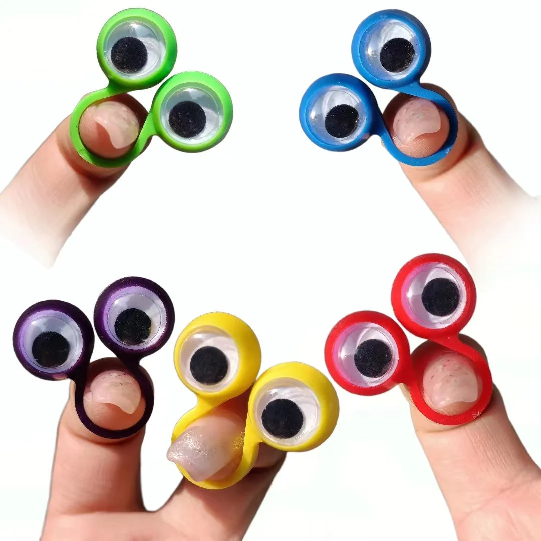 A hand displays four colorful silicone eye rings on fingers, used as sensory fidget toys.