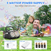 A family enjoying bubbles outdoors with an automatic bubble machine and various battery components.