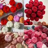 A collection of realistic pink and red rose silicone molds used for candle, soap, and crafting.