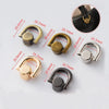 A collection of D-shaped metal bag handles in gold, brass, silver, and black finishes shown with measurement lines.