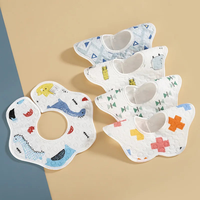 A set of three soft waterproof baby bibs featuring various patterns and colors like blue, yellow, and white.