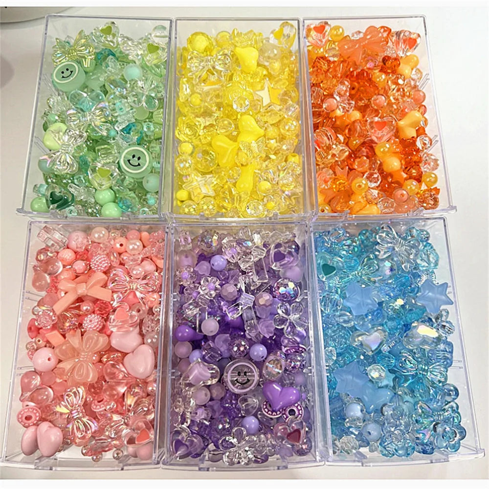 A collection of mixed acrylic bow and flower beads in various colors like green, yellow, orange, pink, purple, and blue for j