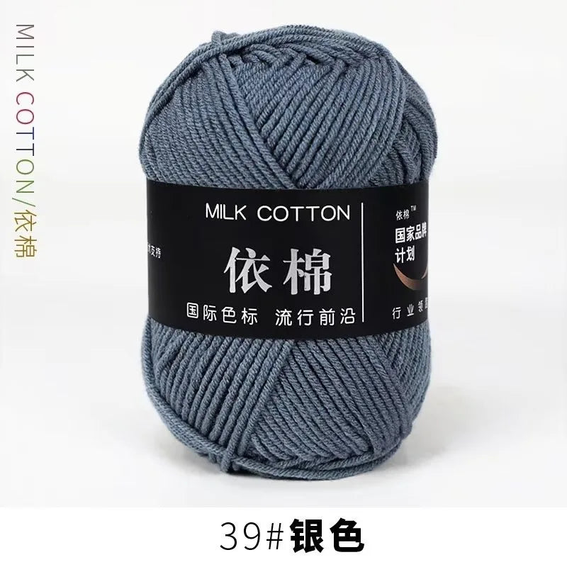 A ball of gray milk cotton yarn labeled 39# in a dark background.
