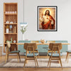 A framed painting of Jesus holding a chalice and Virgin Mary, displayed in a modern living room setting.