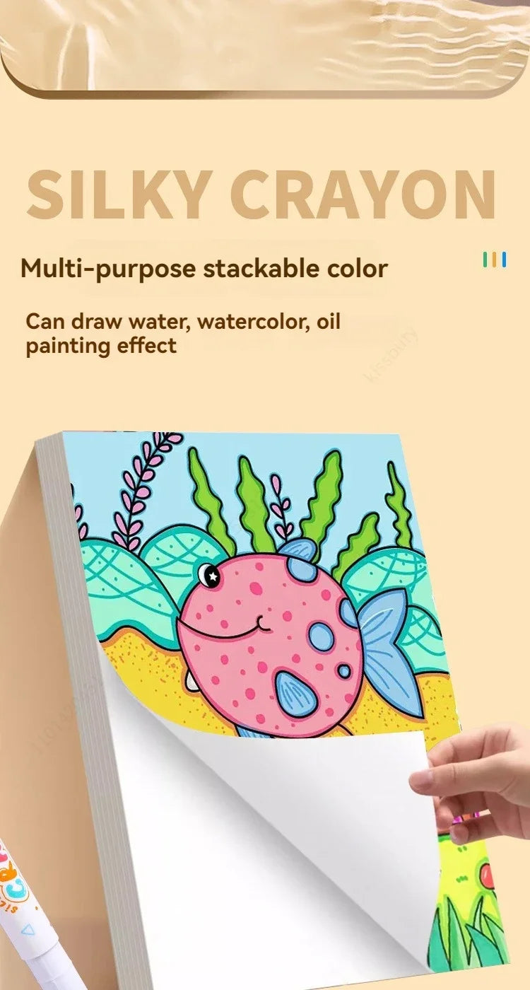 A close-up view of a stackable silky crayon drawing a colorful fish on paper.