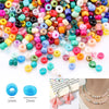 A collection of 12-color glass seed beads in various shades and sizes for DIY jewelry making.