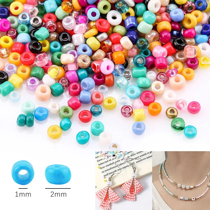 A collection of 12-color glass seed beads in various shades and sizes for DIY jewelry making.