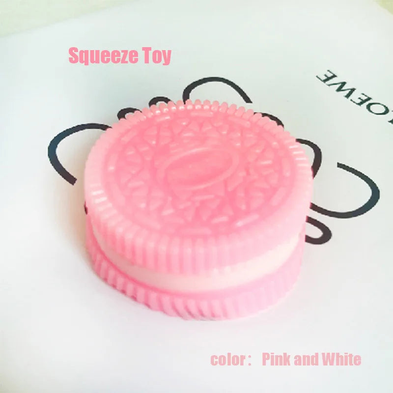 A pink and white silicone squeeze toy or stress relief fidget with a textured surface.