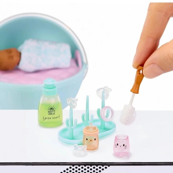 A set of miniature baby food dolls and accessories in various colors including green pink and white