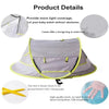 A gray and lime green instant pop-up baby tent with a storage bag and fixing pegs.