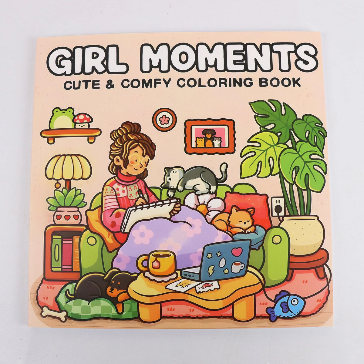 A coloring book cover titled Girl Moments Cute & Comfy Coloring Book featuring illustrations of a girl and various cute objec