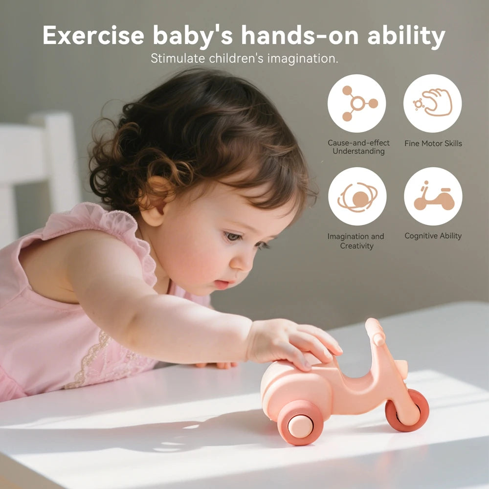 A baby is exercising their hands on a pink silicone toy car while learning fine motor skills and cognitive ability.