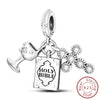 Sterling silver charm beads set featuring cross, angel, and evil eye designs for DIY jewelry making