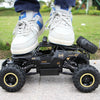 A white and blue high-speed 4WD off-road RC truck with large tires is shown on a concrete surface.