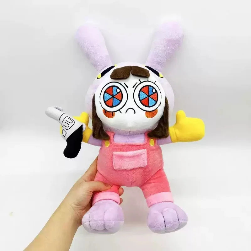 A plush doll resembling a rabbit with pink and purple fur, large eyes, and a black glove.