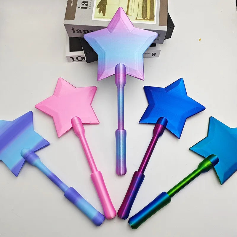 A collection of 3D printed magic wands in various colors including pink, purple, blue, and green, displayed on a white surfac
