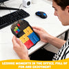 A person is holding an electronic sliding block puzzle with colored blocks and an LED screen on a white desk.