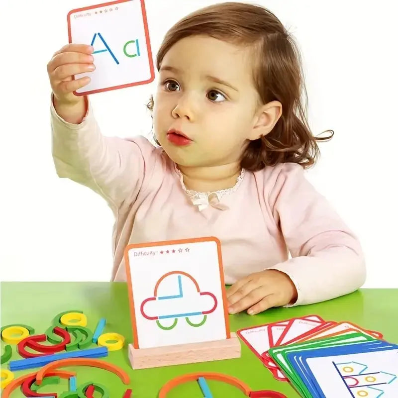 A young child holds up a wooden stick and ring puzzle toy with letters A and c on it.