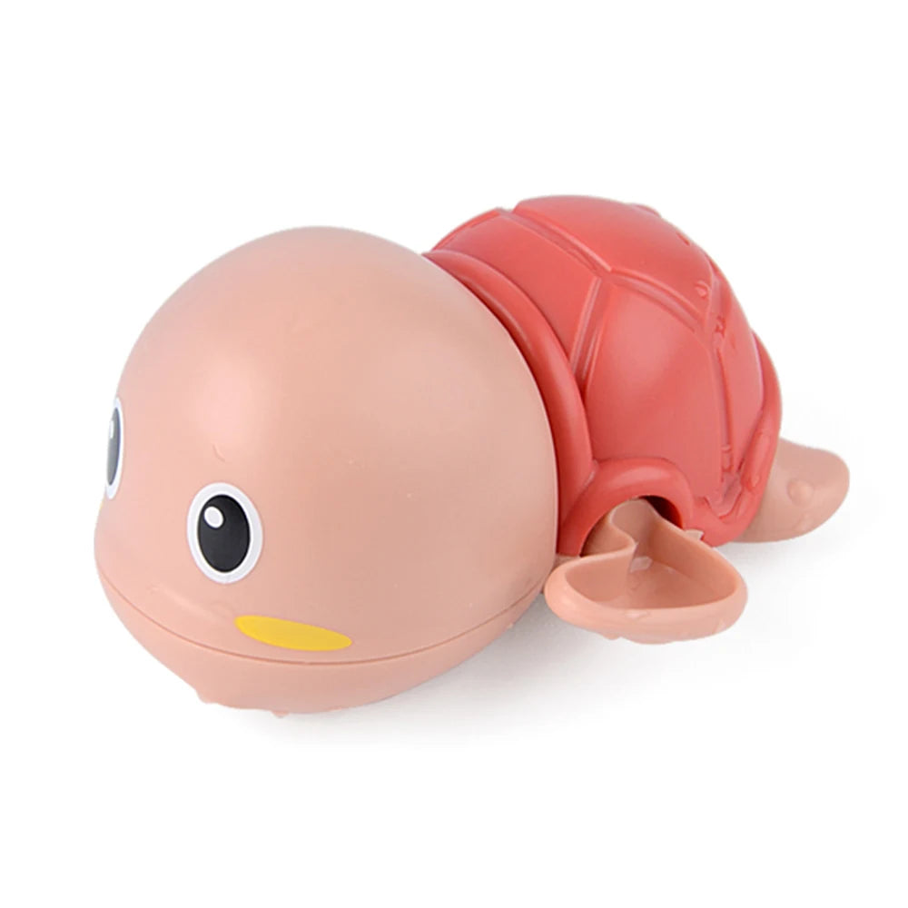 A pink and orange cartoon monkey shower toy with a water sprinkler for kids.