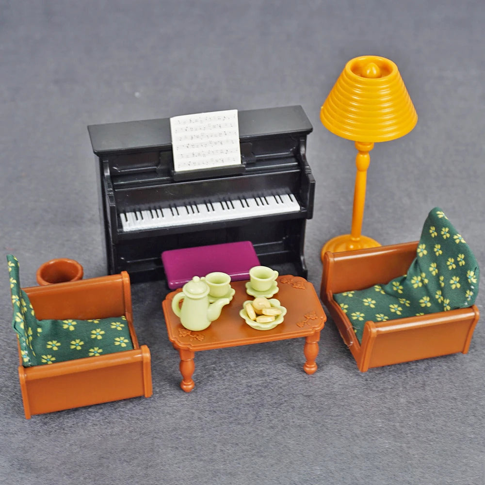 A 1:12 scale dollhouse furniture set featuring a piano, a lamp, and wooden chairs with green fabric.